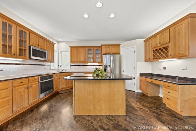 2716 Whitchurch Ct, Naperville, IL 60564 - kitchen featuring dark wood-style flooring, a center island, a sink, stainless steel appliances, and recessed lighting