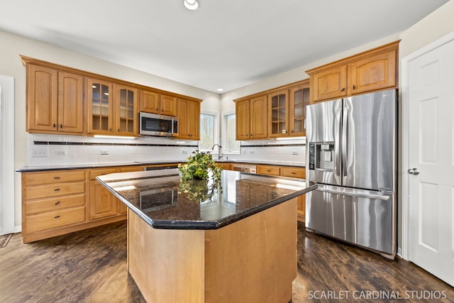 2716 Whitchurch Ct, Naperville, IL 60564 - kitchen featuring glass insert cabinets, dark wood finished floors, dark stone countertops, and stainless steel appliances