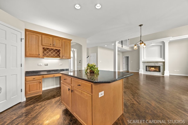2716 Whitchurch Ct, Naperville, IL 60564 - kitchen with a lit fireplace, a center island, hanging light fixtures, dark wood-style floors, and recessed lighting