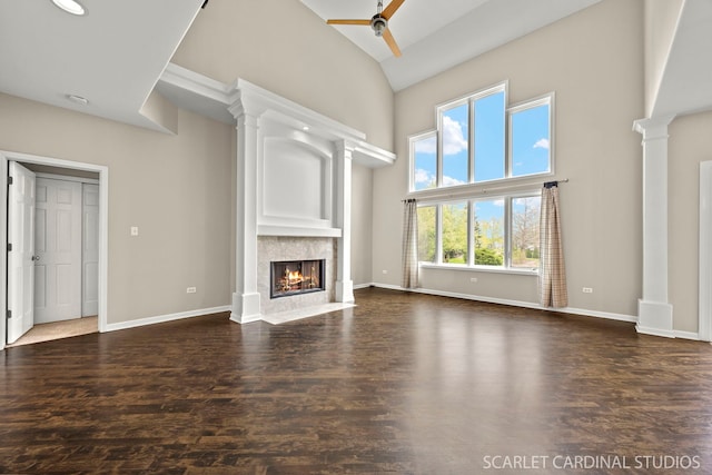 2716 Whitchurch Ct, Naperville, IL 60564 - unfurnished living room with ceiling fan, a fireplace, high vaulted ceiling, baseboards, and decorative columns