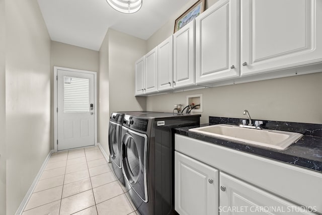 2716 Whitchurch Ct, Naperville, IL 60564 - washroom with cabinet space, washer and dryer, a sink, baseboards, and light tile patterned floors