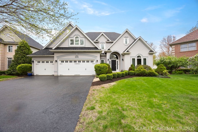 2716 Whitchurch Ct, Naperville, IL 60564 - view of front of house featuring stucco siding, a garage, a front yard, and aphalt driveway