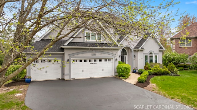 2716 Whitchurch Ct, Naperville, IL 60564 - traditional-style house featuring a shingled roof, stucco siding, an attached garage, and aphalt driveway