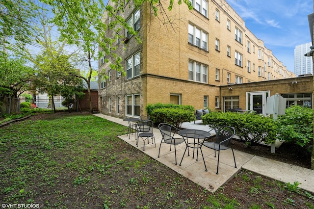 4240 N Clarendon Ave Unit 301S, Chicago, IL 60613 - rear view of house with a patio area and brick siding