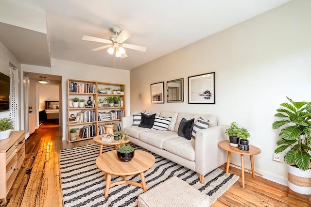 4240 N Clarendon Ave Unit 301S, Chicago, IL 60613 - living room with light wood-type flooring, a ceiling fan, and baseboards