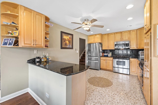 kitchen featuring stainless steel appliances, open shelves, ceiling fan, and a peninsula