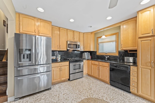 kitchen featuring a sink, decorative backsplash, light brown cabinetry, and stainless steel appliances