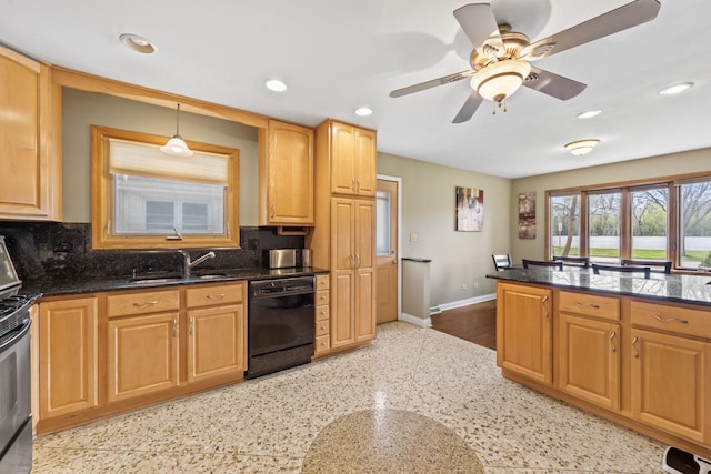 kitchen featuring baseboards, a sink, decorative backsplash, and dishwasher