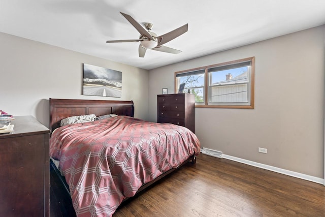bedroom with baseboards, ceiling fan, wood finished floors, and visible vents