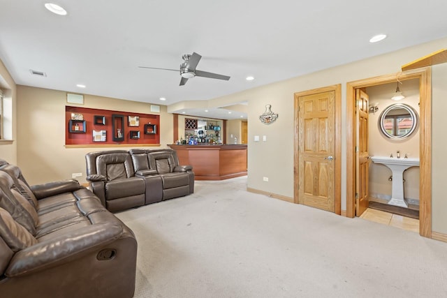living room featuring visible vents, recessed lighting, light colored carpet, and indoor bar