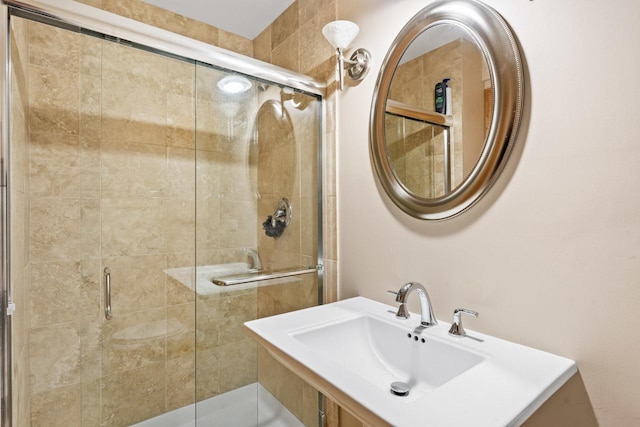 bathroom featuring a sink and a stall shower