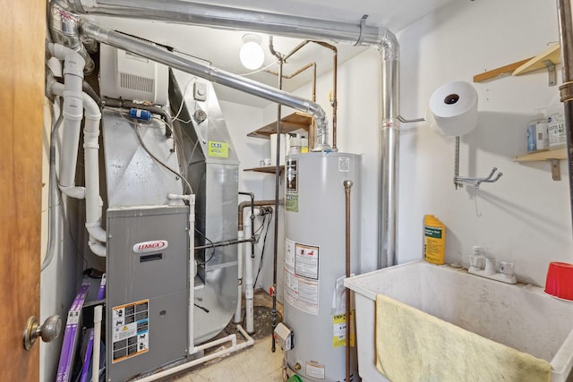 utilities featuring a sink, heating unit, and gas water heater