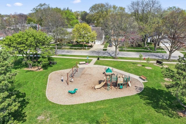 view of community featuring a lawn and playground community