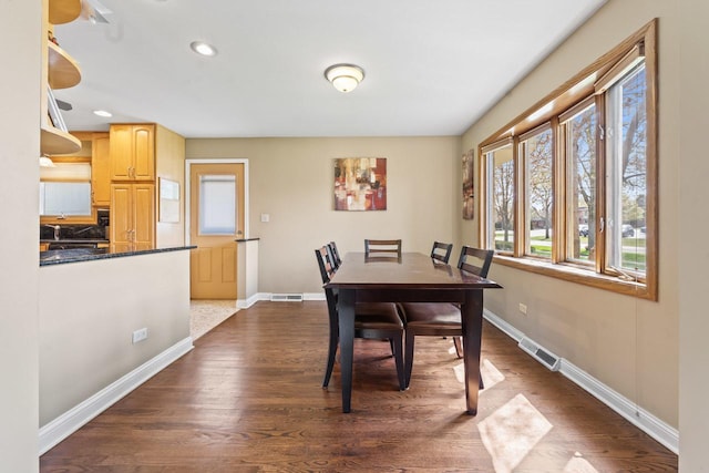 dining space with visible vents, baseboards, and a wealth of natural light