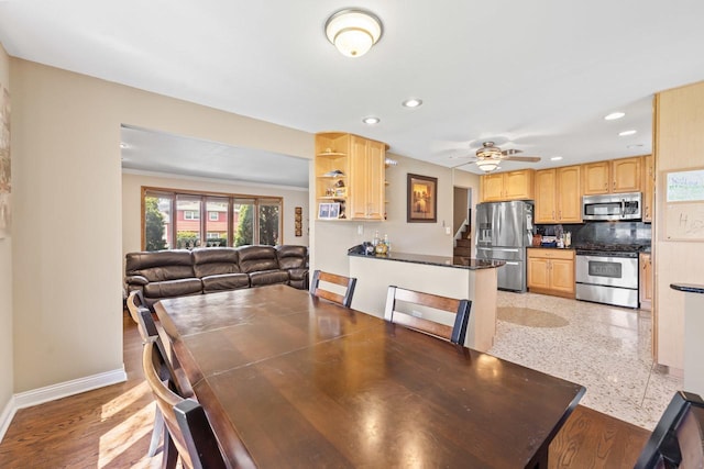 dining room featuring baseboards, ceiling fan, and recessed lighting