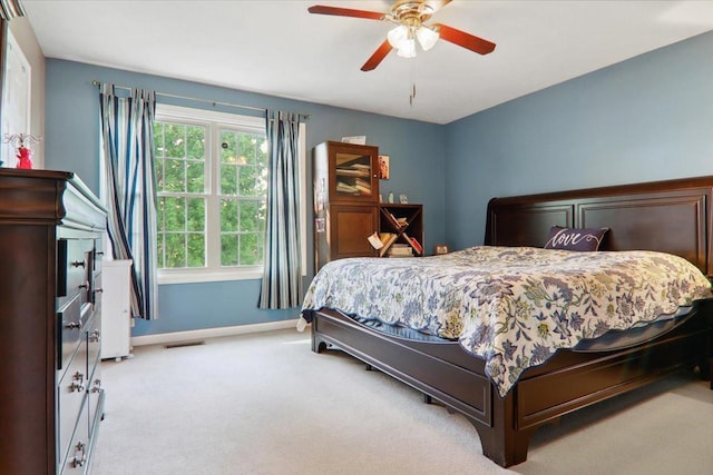 2 Reading Rd, Bloomington, IL 61701 - bedroom featuring visible vents, carpet flooring, baseboards, and ceiling fan