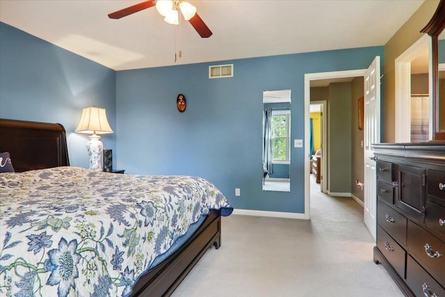 2 Reading Rd, Bloomington, IL 61701 - bedroom with light colored carpet, baseboards, visible vents, and ceiling fan