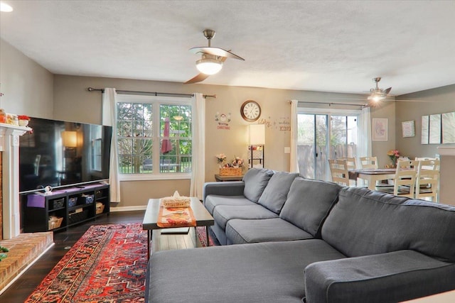 2 Reading Rd, Bloomington, IL 61701 - living area featuring ceiling fan and dark wood-style flooring