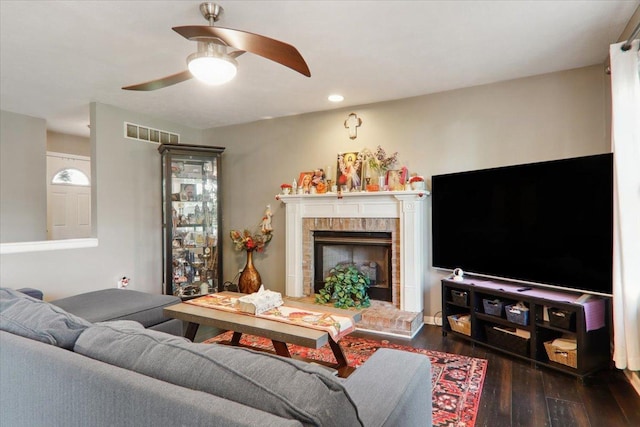 2 Reading Rd, Bloomington, IL 61701 - living room with ceiling fan, a fireplace, recessed lighting, dark wood-type flooring, and visible vents
