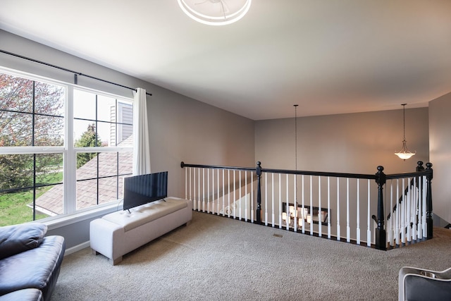 sitting room with carpet floors and baseboards
