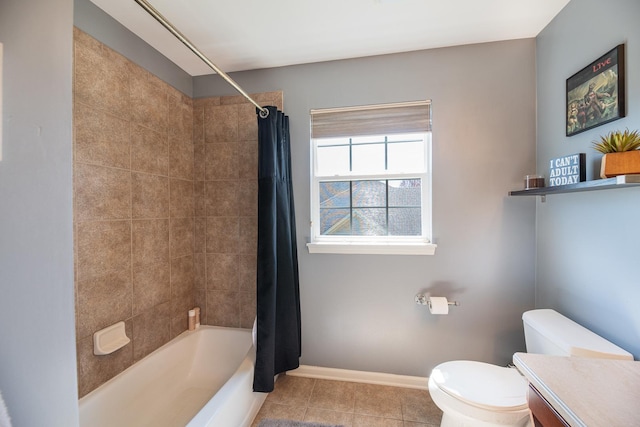 bathroom with baseboards, shower / tub combo, tile patterned floors, and toilet