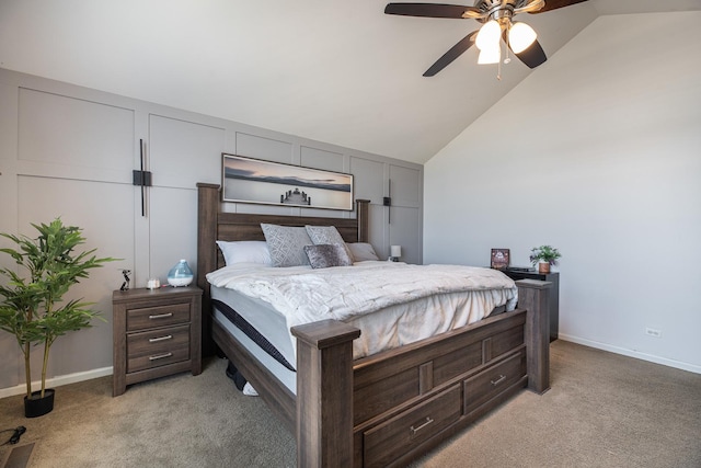 bedroom featuring baseboards, light colored carpet, and vaulted ceiling