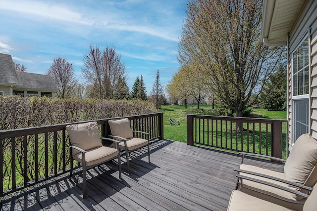 wooden terrace with a yard