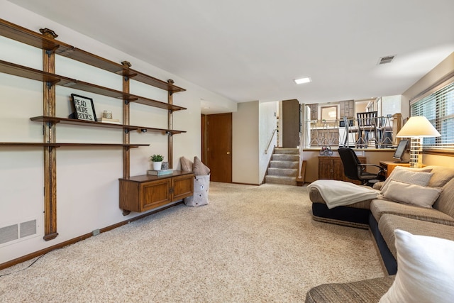 living room with carpet flooring, stairway, a desk, and baseboards