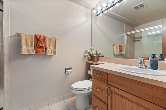 full bathroom with tile patterned floors, a shower stall, toilet, and vanity