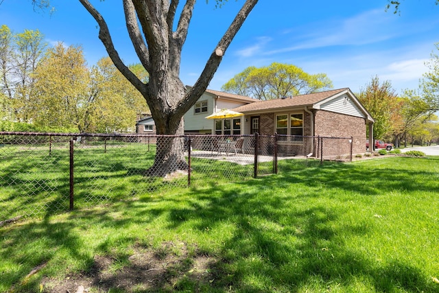 rear view of house featuring brick siding