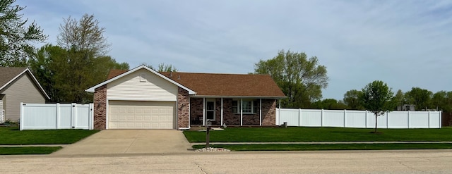 ranch-style home with a garage, a front lawn, fence, brick siding, and driveway