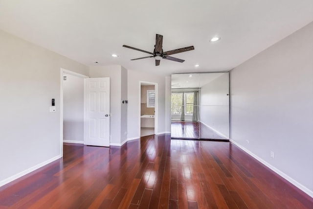 unfurnished room featuring a ceiling fan, wood finished floors, baseboards, and recessed lighting