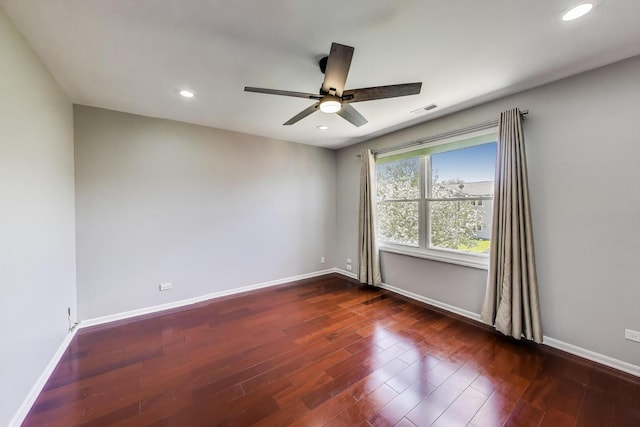spare room featuring dark wood-style flooring, ceiling fan, baseboards, and recessed lighting