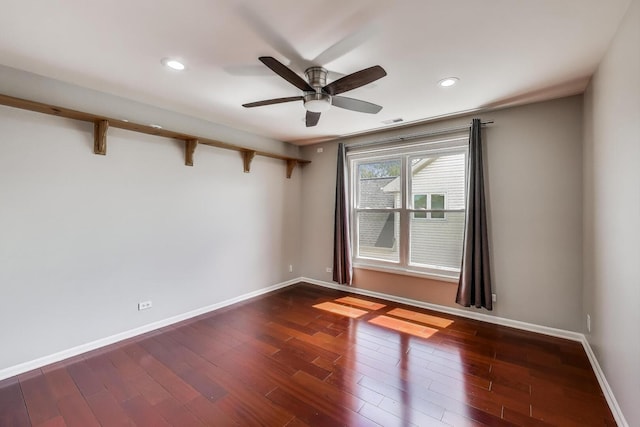 empty room with dark wood finished floors, baseboards, ceiling fan, and recessed lighting