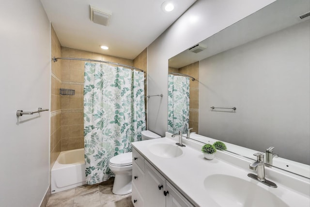 full bath with toilet, double vanity, shower / bath combo, and recessed lighting