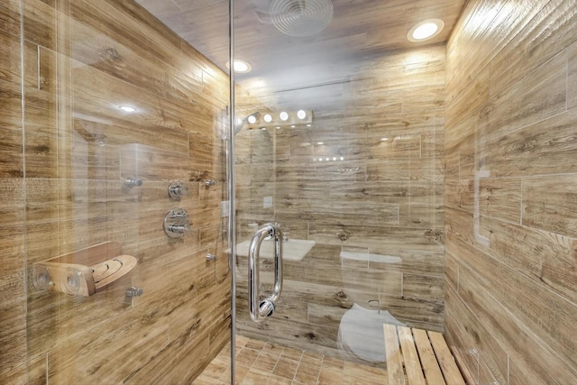 bathroom with tiled shower