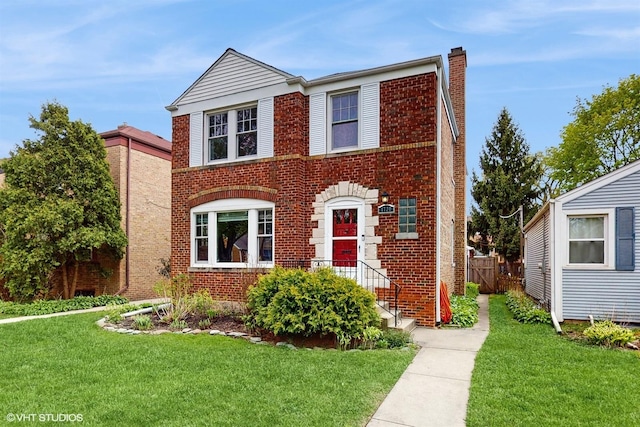 1730 Madison St, Evanston, IL 60202 - traditional-style home with brick siding and a chimney