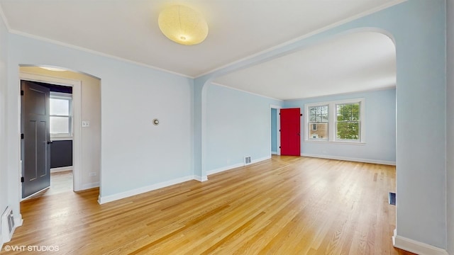 1730 Madison St, Evanston, IL 60202 - spare room with arched walkways, light wood-style floors, ornamental molding, and baseboards
