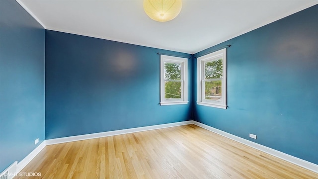 1730 Madison St, Evanston, IL 60202 - spare room with baseboards, wood finished floors, and ornamental molding