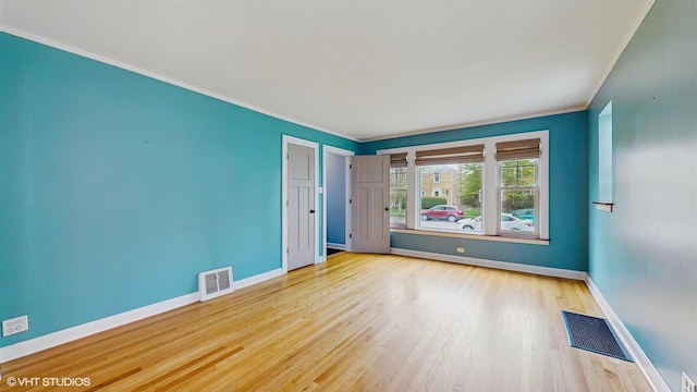 1730 Madison St, Evanston, IL 60202 - spare room with baseboards, wood finished floors, and crown molding