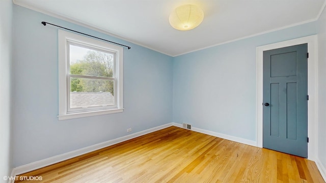 1730 Madison St, Evanston, IL 60202 - empty room with light wood-type flooring, ornamental molding, and baseboards