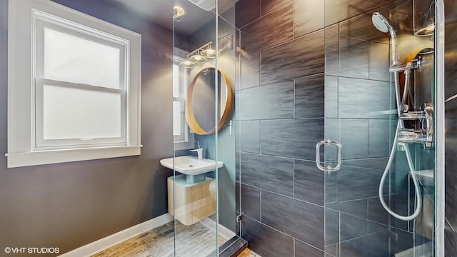 1730 Madison St, Evanston, IL 60202 - bathroom with a stall shower, baseboards, and wood finished floors