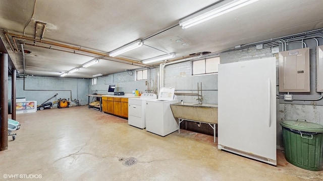 1730 Madison St, Evanston, IL 60202 - basement featuring electric panel, washer and clothes dryer, freestanding refrigerator, and a sink