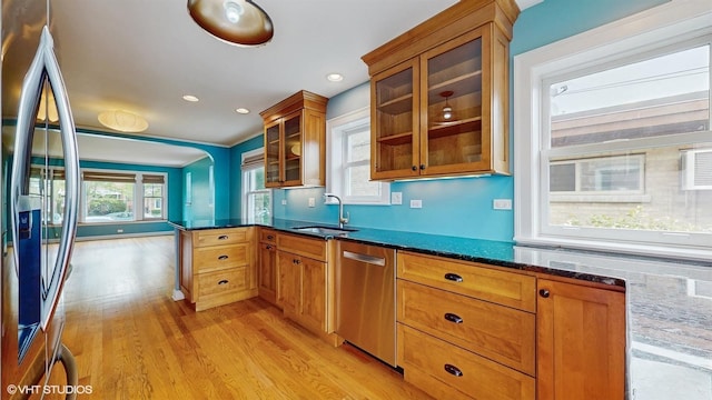1730 Madison St, Evanston, IL 60202 - kitchen featuring appliances with stainless steel finishes, a sink, light wood-style floors, brown cabinets, and recessed lighting