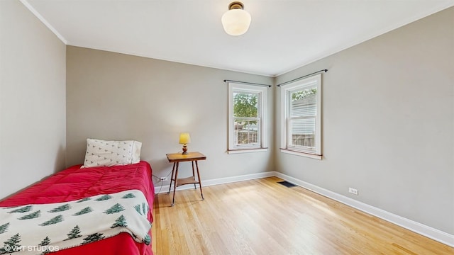 1730 Madison St, Evanston, IL 60202 - bedroom with wood finished floors, baseboards, and crown molding