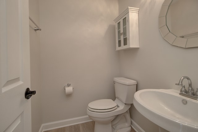 1877 Westmore Grove Dr, Plainfield, IL 60586 - bathroom with a sink, toilet, baseboards, and wood finished floors