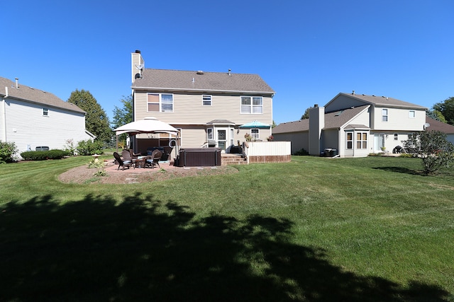 1877 Westmore Grove Dr, Plainfield, IL 60586 - back of property with a gazebo, a yard, and a chimney