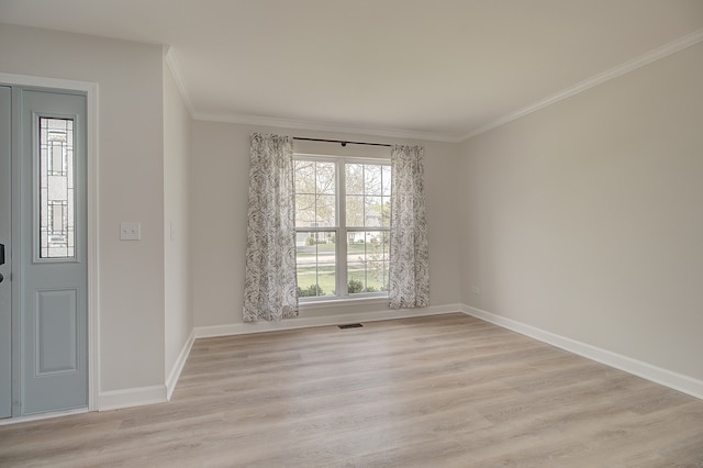 1877 Westmore Grove Dr, Plainfield, IL 60586 - empty room with ornamental molding, light wood-style flooring, and baseboards