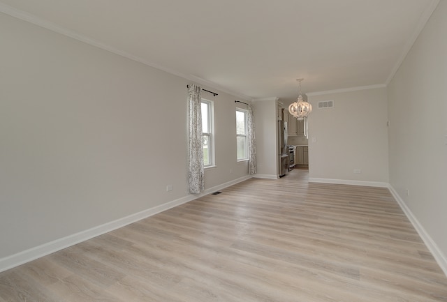 1877 Westmore Grove Dr, Plainfield, IL 60586 - spare room featuring a chandelier, light wood finished floors, crown molding, and baseboards