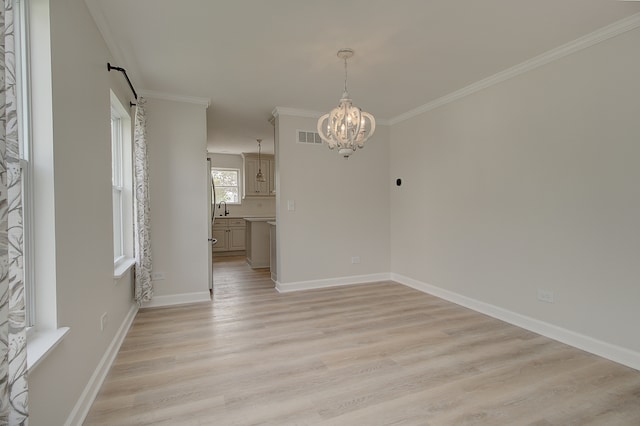 1877 Westmore Grove Dr, Plainfield, IL 60586 - unfurnished dining area with a chandelier, a barn door, light wood-type flooring, ornamental molding, and a sink